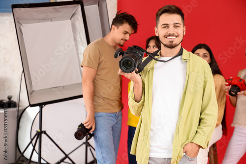 Handsome photographer with ...
