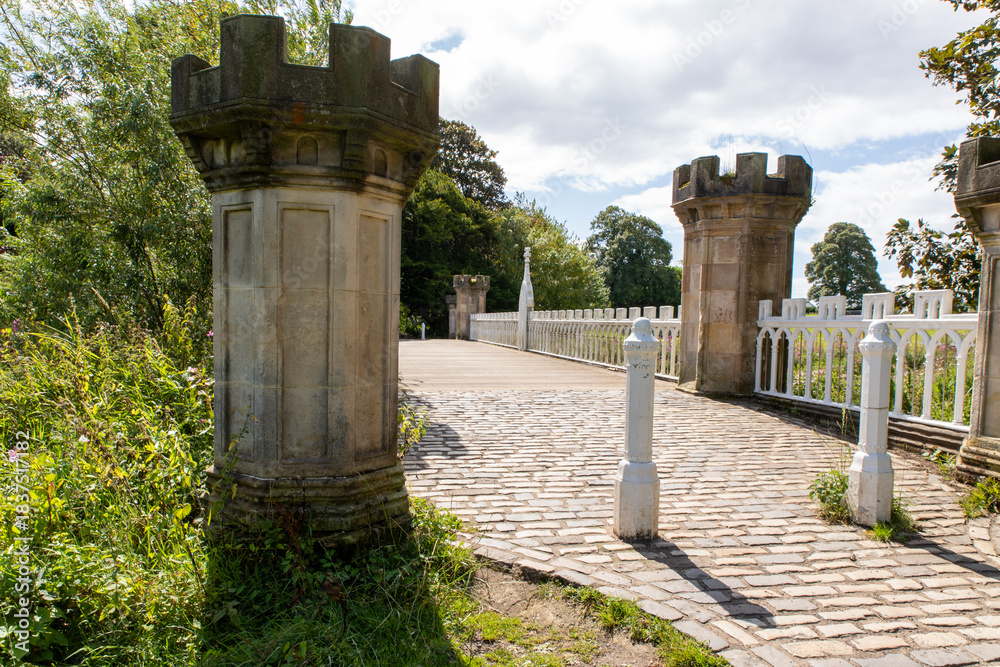 Fototapeta premium The Eglinton Tournament Bridge is a bridge located within Eglinton Country Park near Kilwinning, North Ayrshire, Scotland. UK. The bridge crosses the Lugton Water northwest of Eglinton Castle. 