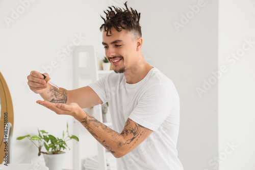 Young man with dreadlocks a...
