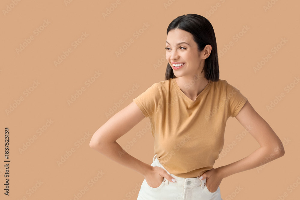 Obraz premium Beautiful young woman with short hair on brown background