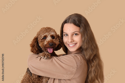 Teenage girl with Poodle do...