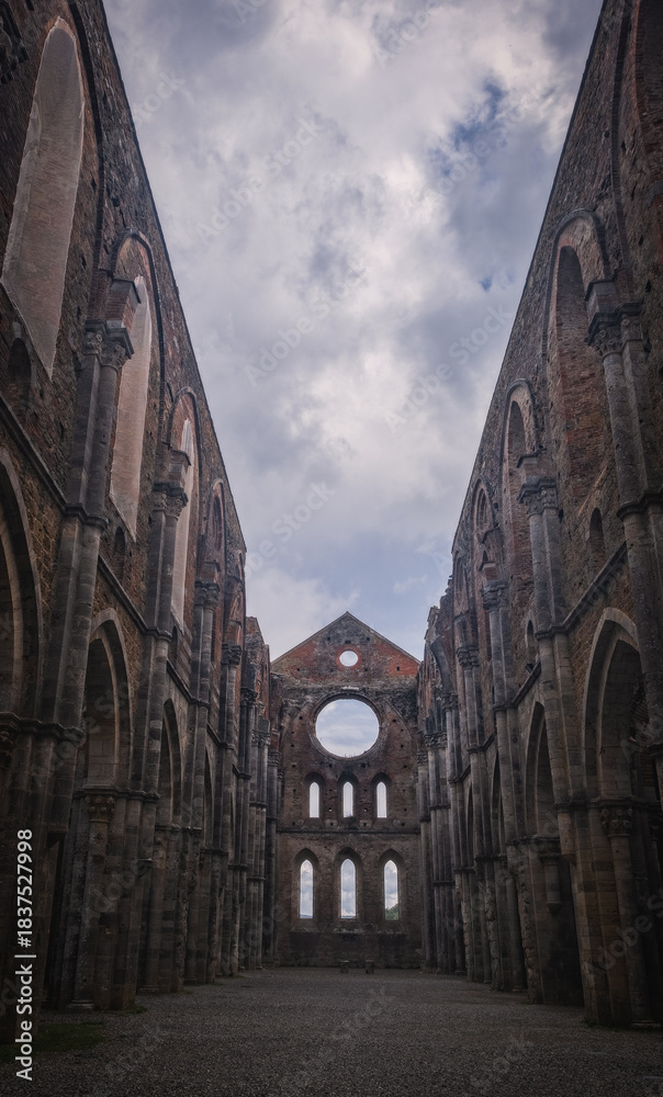 Fototapeta premium Abbey of San Galgano with collapsed roof after a lightning strike on the bell tower. October 2022
