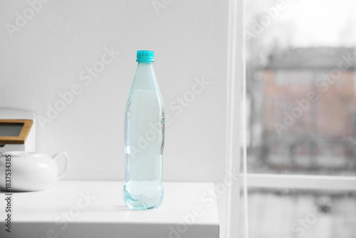Bottle of water on table in...