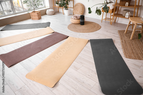 Yoga mats on floor in studi...