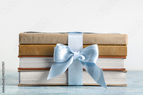 Stack of books tied with gi...