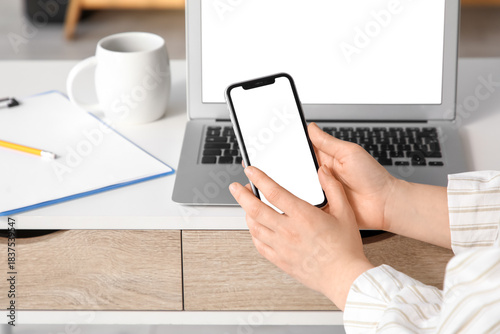 Young woman with blank mobi...