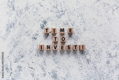 Cubes with text TIME TO INV...