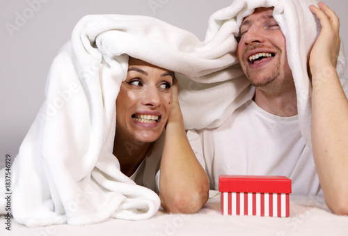 Couple bed. Smile, bed and happy couple hug, relax. Happy day. Christmas time. Holidays. Photo. Smiling. 