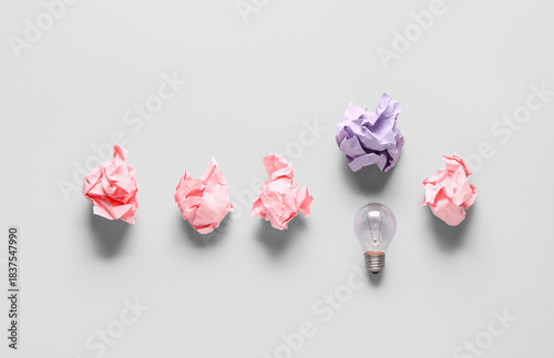 Light bulb with crumpled pa...