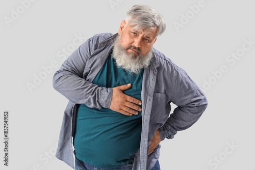 Senior man having heart att...