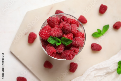 Glass with fresh raspberry ...