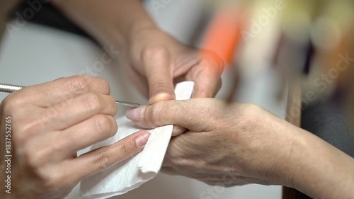 Step by Step Guide to a Classic French Manicure With Pastel Tones. Cuticle treatment with cuticle pusher