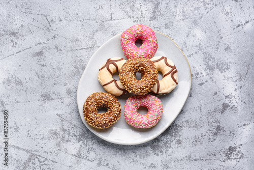 Plate with sweet donuts on ...
