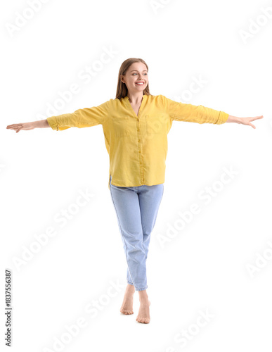 Young woman balancing on wh...