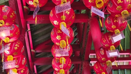 red lantern lights under the roof of the Chinese Confucian temple