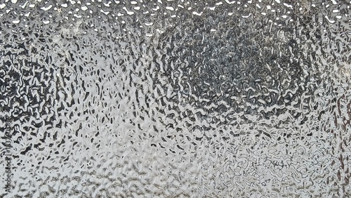 Blurred frosted glass texture. Window backdrop with shadows and reflections. Glass effect background. Abstract gradient bright light reflection and shiny rough texture surface