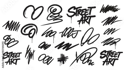Black graffiti tags scribbles and STREET ART text on white background