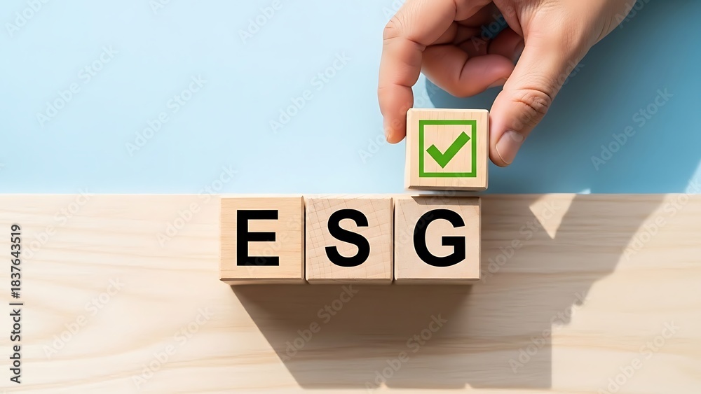 Naklejka premium ESG concept with wooden blocks and a hand placing a checkmark block.