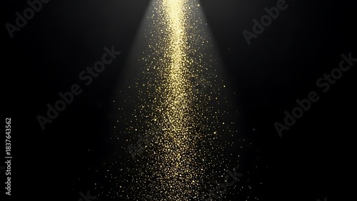 Ethereal cascade of sparkling gold glitter in a light beam. © chan