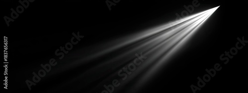 Bright light beams shooting upward from the darkness
