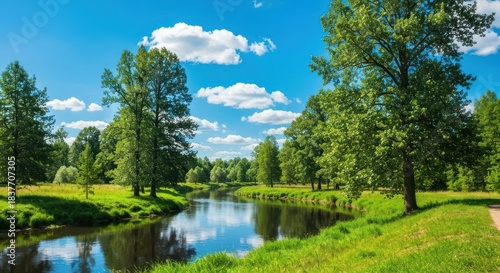 Sunny river meanders through lush green parkland