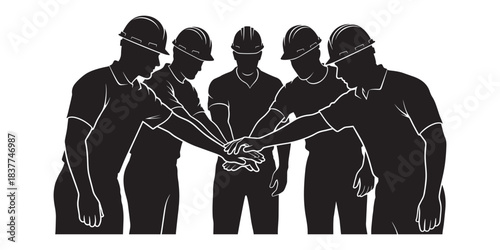 Silhouette of a construction team in hard hats putting their hands together representing teamwork and unity