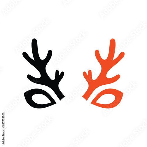 a striking visual composition displays two stylized deer antler forms one rendered in black and the other in vibrant orange presented side by side