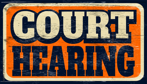 Aged and worn court hearing sign on wood