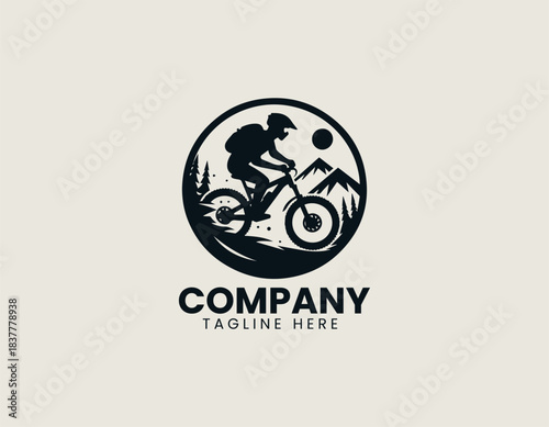 Mountain biker silhouette riding rugged trail in dynamic black vector logo illustration