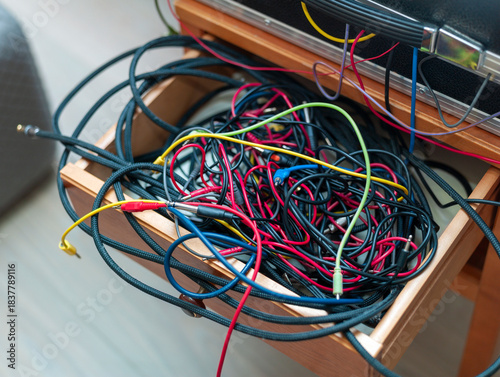 audio cables inside a cabinet drawer