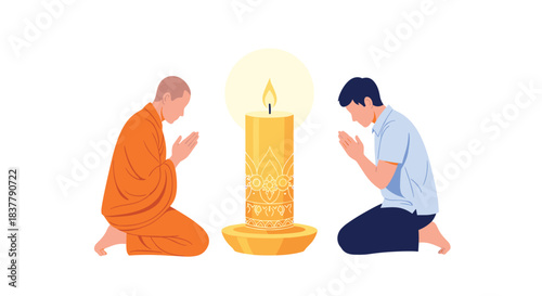 Buddhist monk in an orange robe and a layman praying together kneeling in front of a large decorated and lit candle.