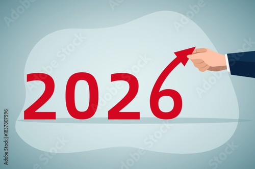 Bold red "2026" text paired with a business hand holding an upward red arrow, symbolizing growth, progress, and positive momentum for the year 2026.