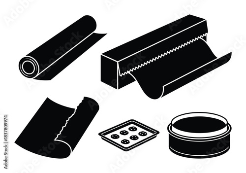 Baking paper set, foil roll, dispenser, cookie sheet, and round baking pan, kitchen supplies.