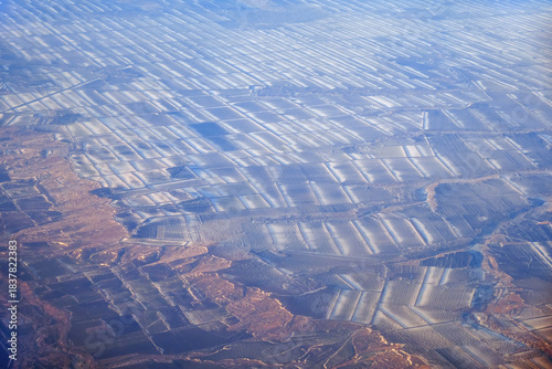 Aerial view of snow-covered fields in winter