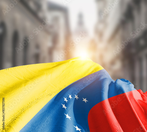 Venezuela flag fluttering on blur street with building. Venezuela national flag for independence day.