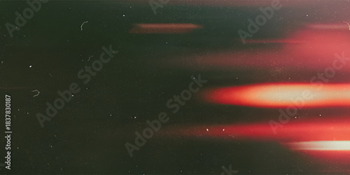 leak overlay effect with scratch dust and motion blur red light leaks,retro noisy film texture light leak flare on black background,abstract background with ray,grunge film strip background