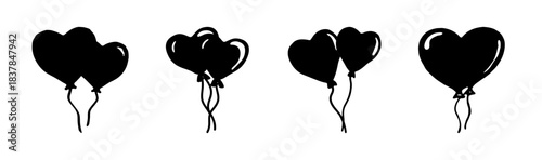 Collection of black heart balloons isolated, symbolizing love and celebration.