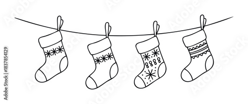 Christmas stockings with festive designs hanging on a string, perfect for holiday greetings, winter celebrations, and seasonal decorations.
