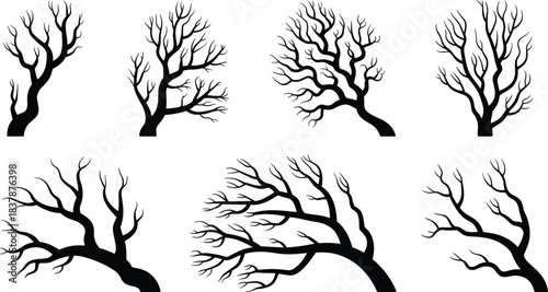 Set of Spooky Bare Tree Silhouettes: Leafless, Wind-Blown, and Gnarled Branches Representing Harsh Winter Weather, Dead Vegetation, Halloween, and Eerie Landscape Design