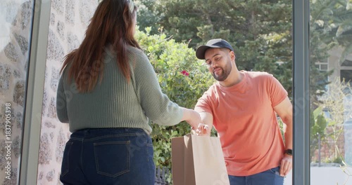 Courier arriving, handing bag at doorstep, customer scanning code to complete delivery