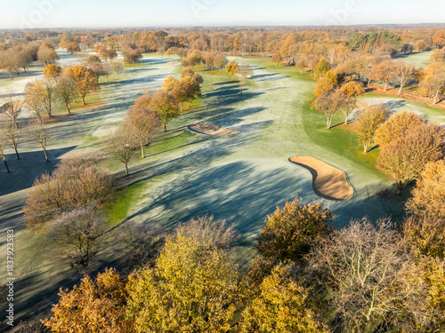 Aerial View of Frosty Golf Fairway with Autumn Trees and Sand Bunkers