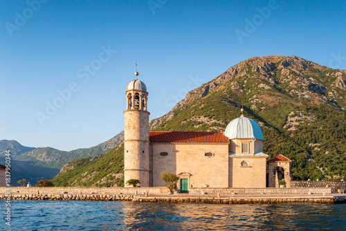 Our lady of the rocks church in Perast at sunset. Bay of Kotor. UNESCO Natural and Culture Historical Region. Montenegro.