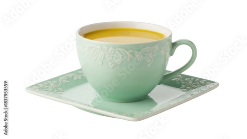 Canvas Print Isolated light-green teacup and saucer with yellow liquid, on a light-green sauc