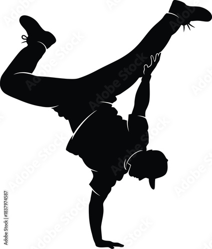 Silhouette of a man performing a one-handed breakdance freeze
