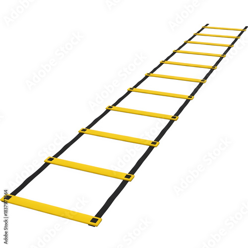Yellow athletic agility ladder stretched out on a dark surface for sports training