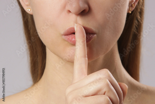 Finger on lips - silent gesture	