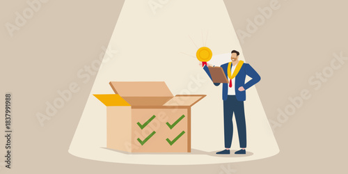 A businessman discovers a golden coin inside an open cardboard box