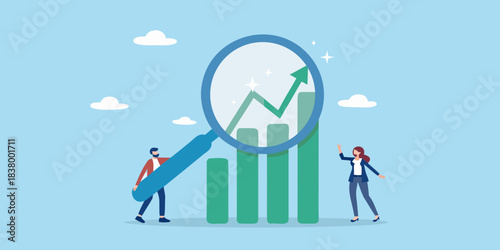 Analyzing growth and progress business people examining upward trending charts