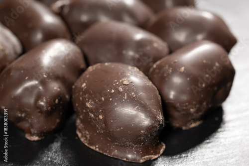 Wallpaper Mural Large dark chocolate candies on dark background Torontodigital.ca