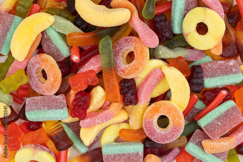 Valokuva Tasty colorful jelly candies as background, above view
